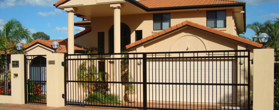 Technician repairing automatic gate opener system