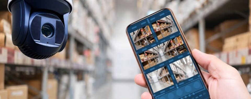Person watching live security camera footage on mobile device